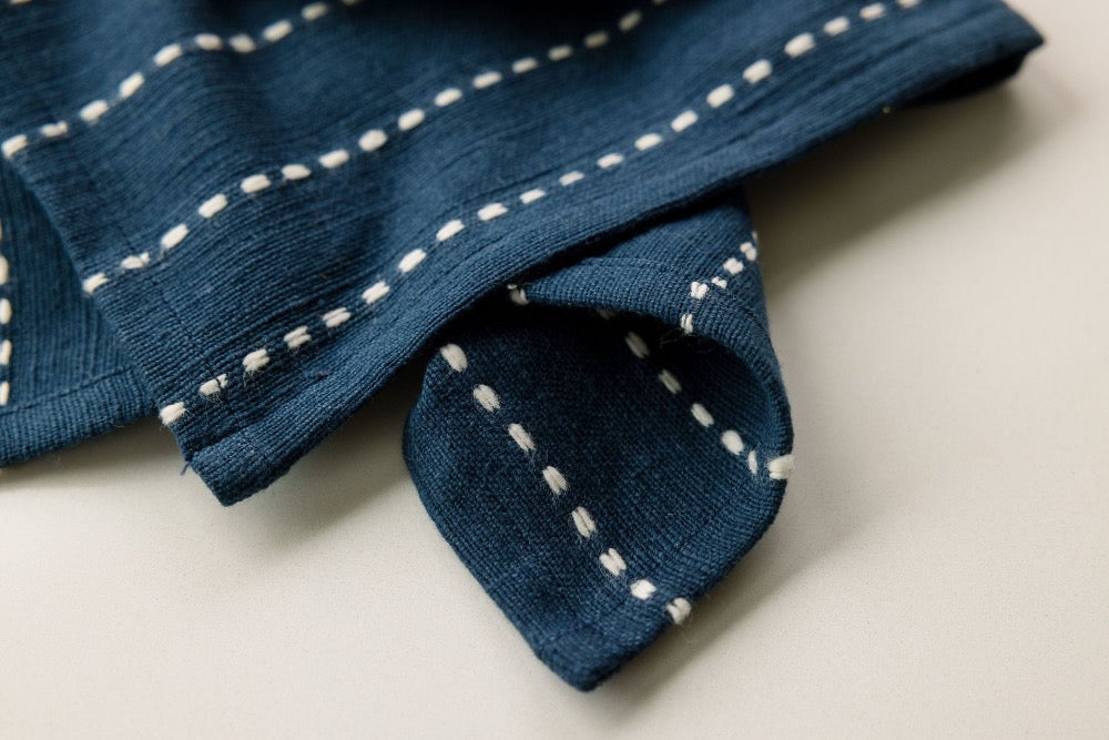 The details of the Rift Valley Cocktail napkin in navy