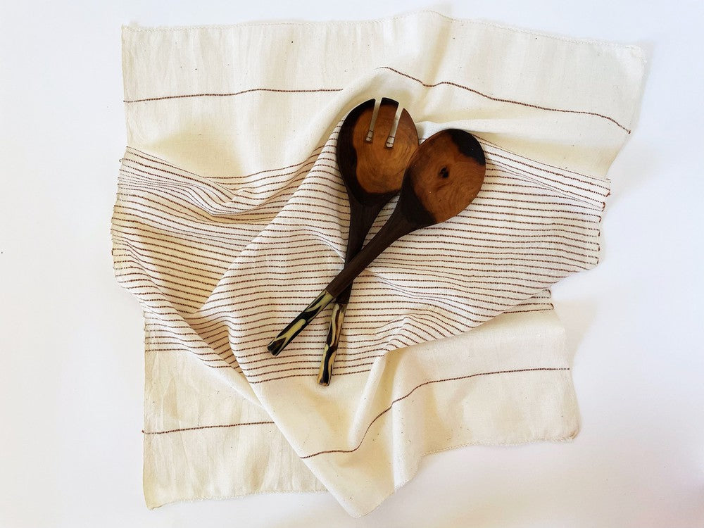 Roha napkin in bronze unfolded on white background with cutlery