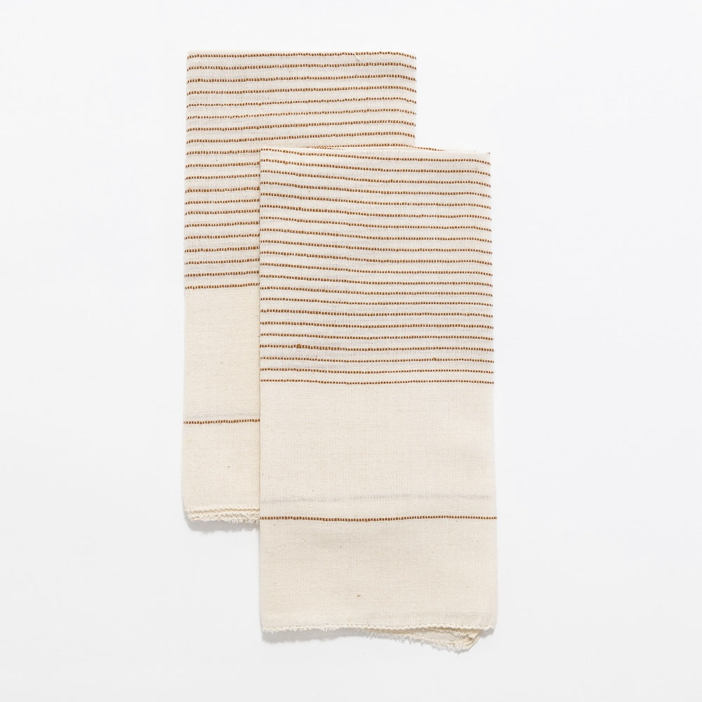 Roha napkin in bronze flat lay on a white background