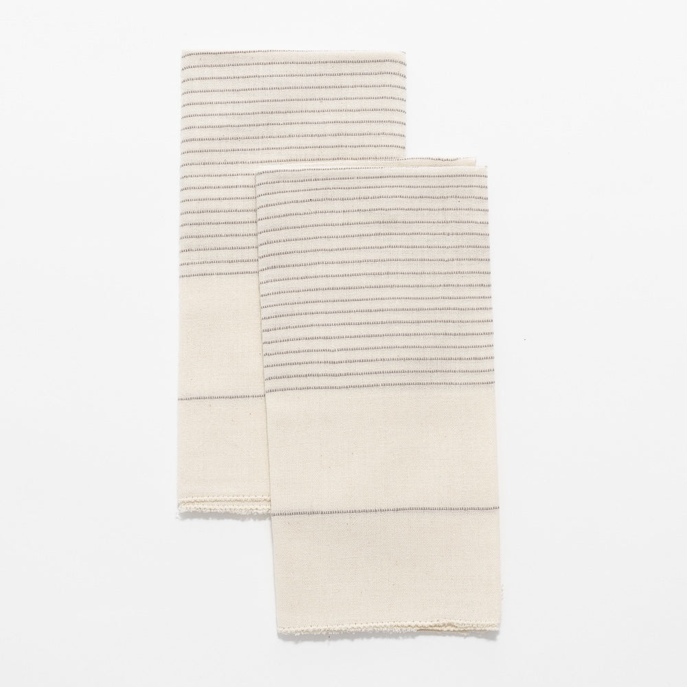 Roha napkin in stone flat lay on a white background