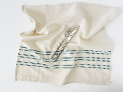 Sodo napkin in flax unfolded on a white background