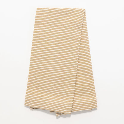 Turkana tea towel in bronze folded on white background