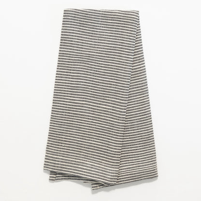 Turkana tea towel in grey folded on white background