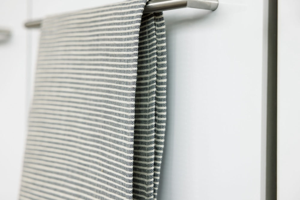 Turkana tea towel in grey hanging