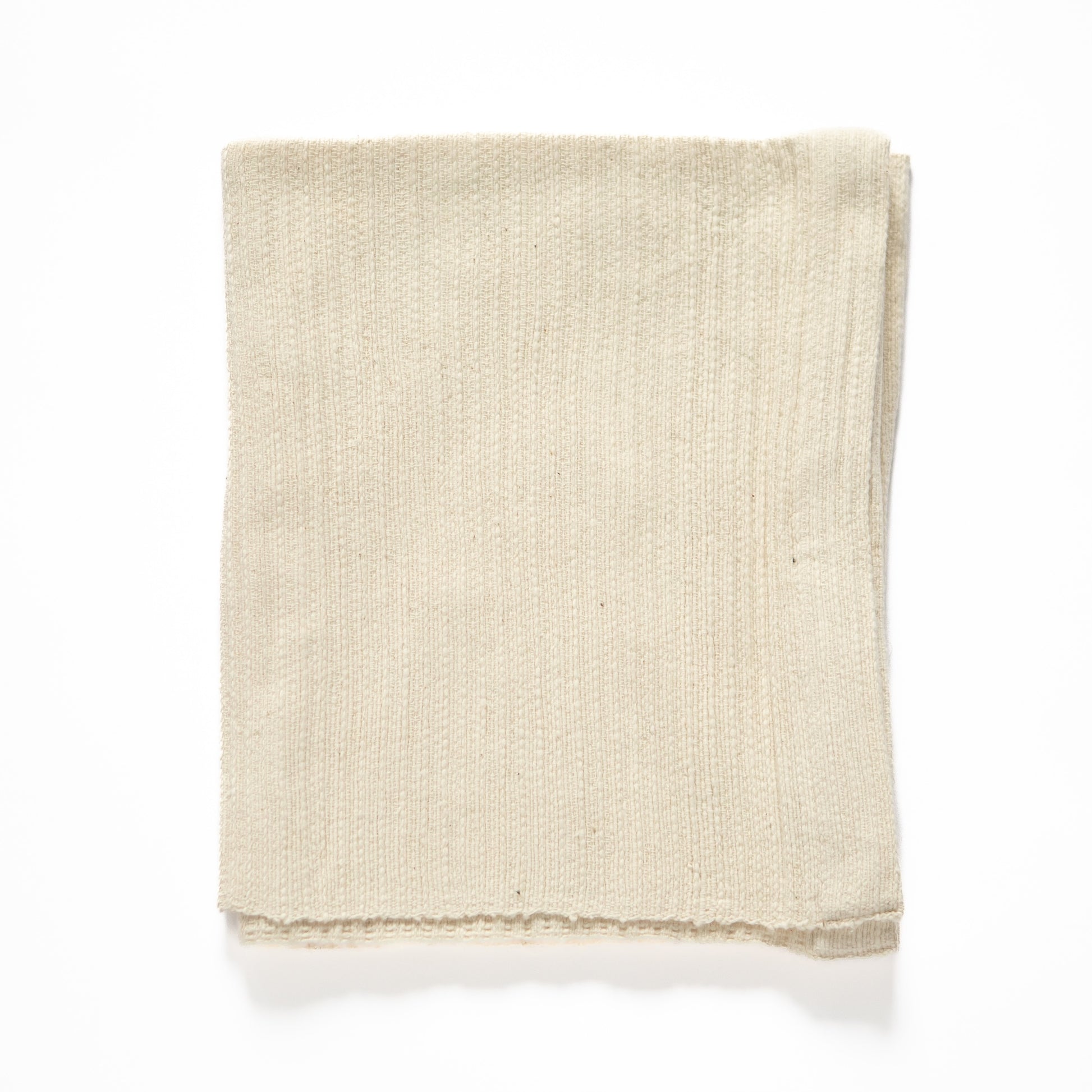 zarima towel flat lay in ivory on white background