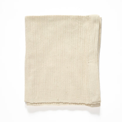zarima towel flat lay in ivory on white background