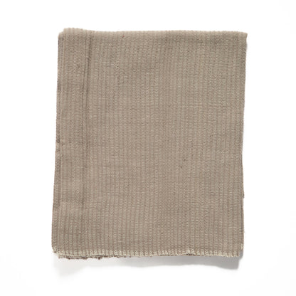 Zarima towel flat lay in stone on white background