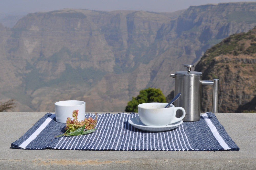 Navy Adwa placemat with cup and saucer