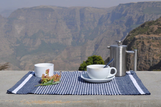 Navy Adwa placemat with cup and saucer