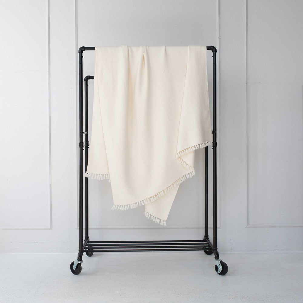 Mechot Throws Blanket in Ivory on Bar with white background