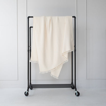 Mechot Throws Blanket in Ivory on Bar with white background