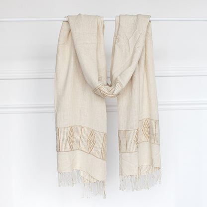 Queen Menon shawl in Ivory and beige on bar with white background