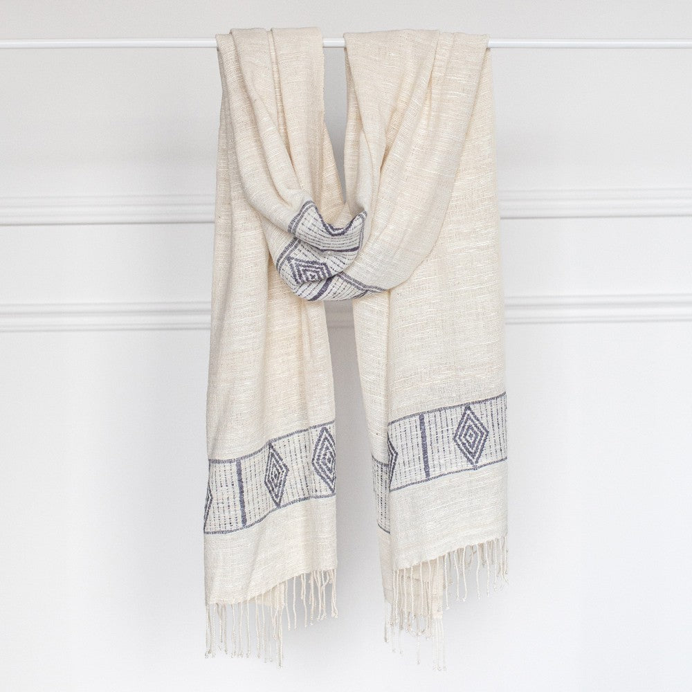 Queen Menon shawl in Ivory and grey on bar with white background