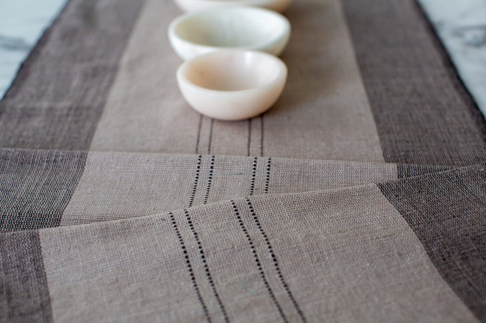 Sodo table runner in stone close up 